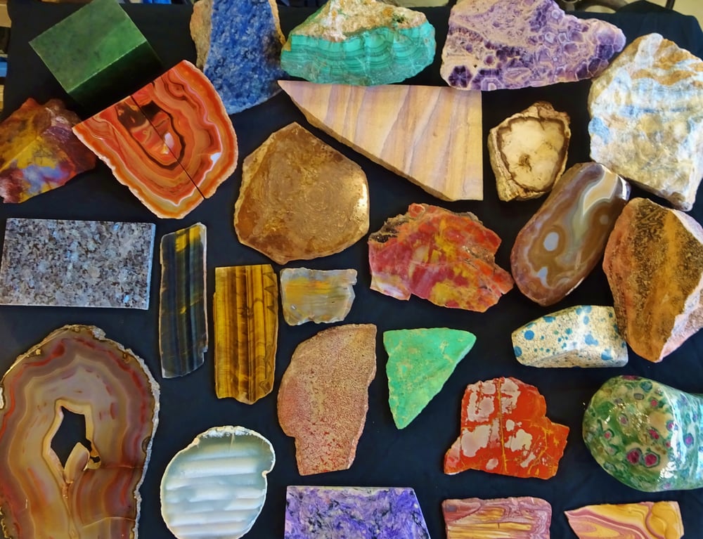 Some colorful rocks from my collection, including agate, amethyst,chrysoprase, fossil dino bone, jade, jasper, malachite, tiger's eye and petrified wood.  How many can you identify?