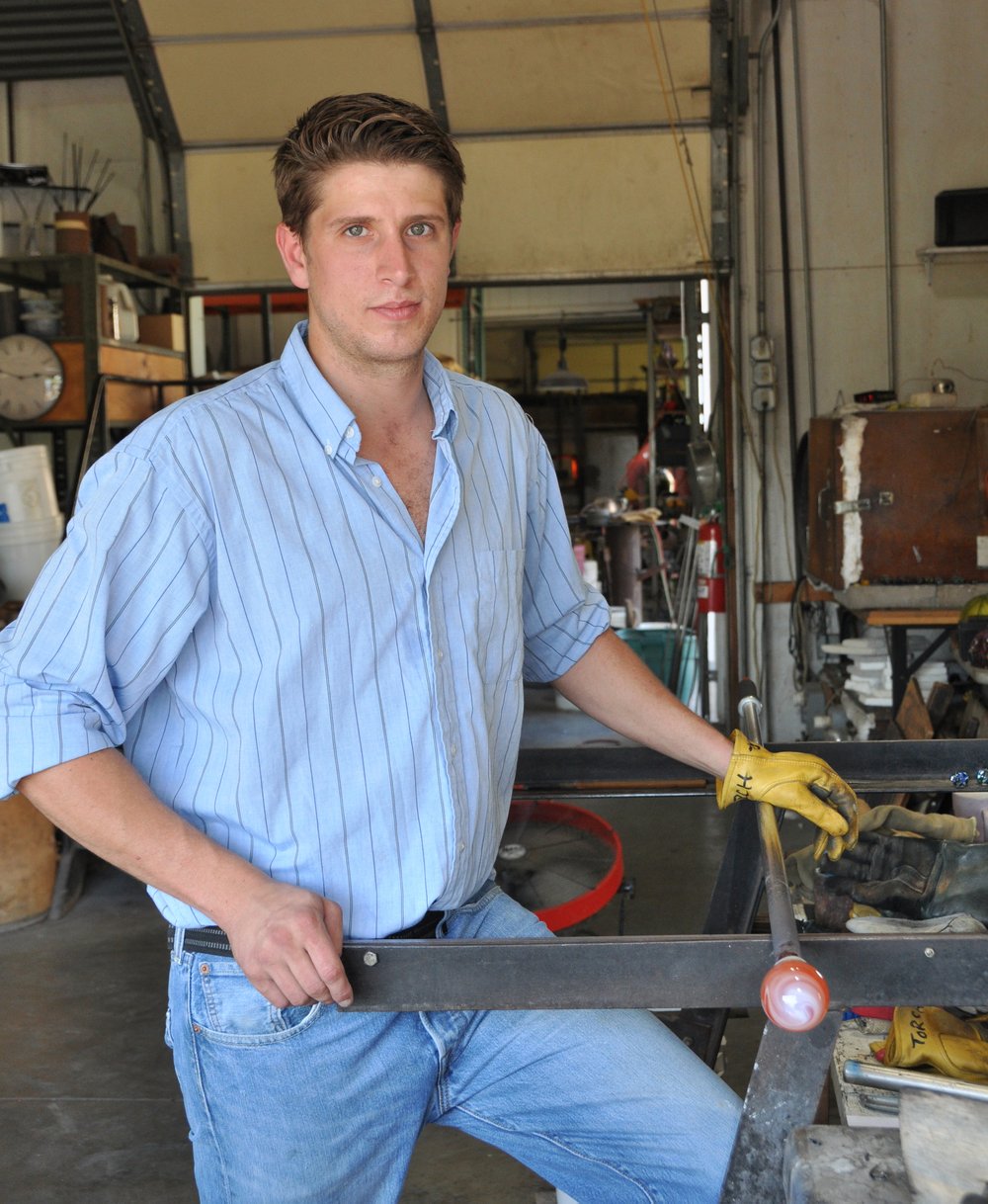 person holding torch and metal