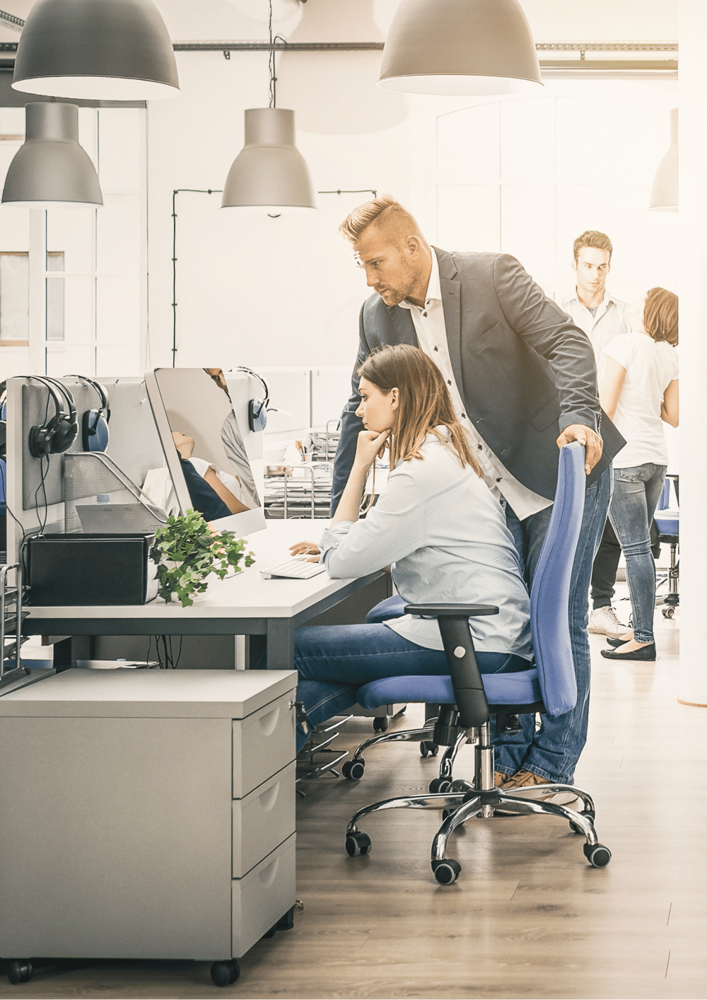 man sitting beside woman looking at a contract on DocuSign