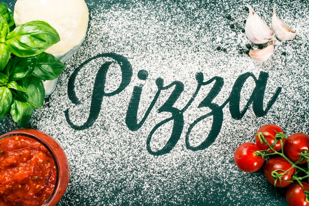 Pizza-Sign with flour, tomato-sauce, garlic and mozzarella