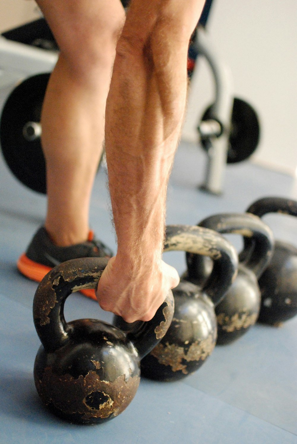 Man hand grip tight to a kettlebell