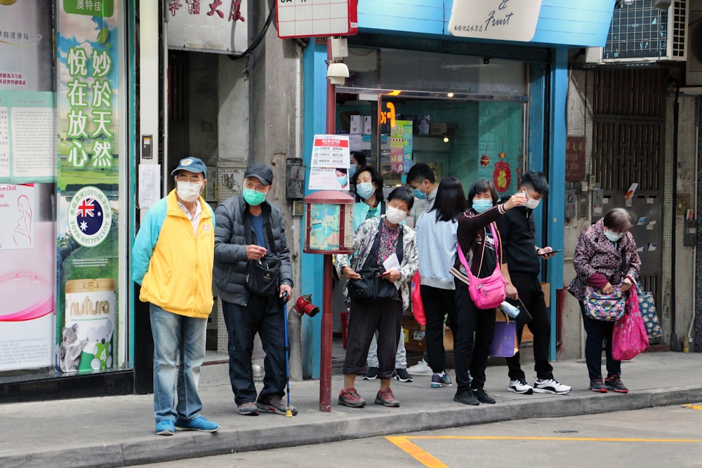 Elderlies wearing face masks at a Bus stop in Macau, China in the surroundings of the public hospital.
(RW) 