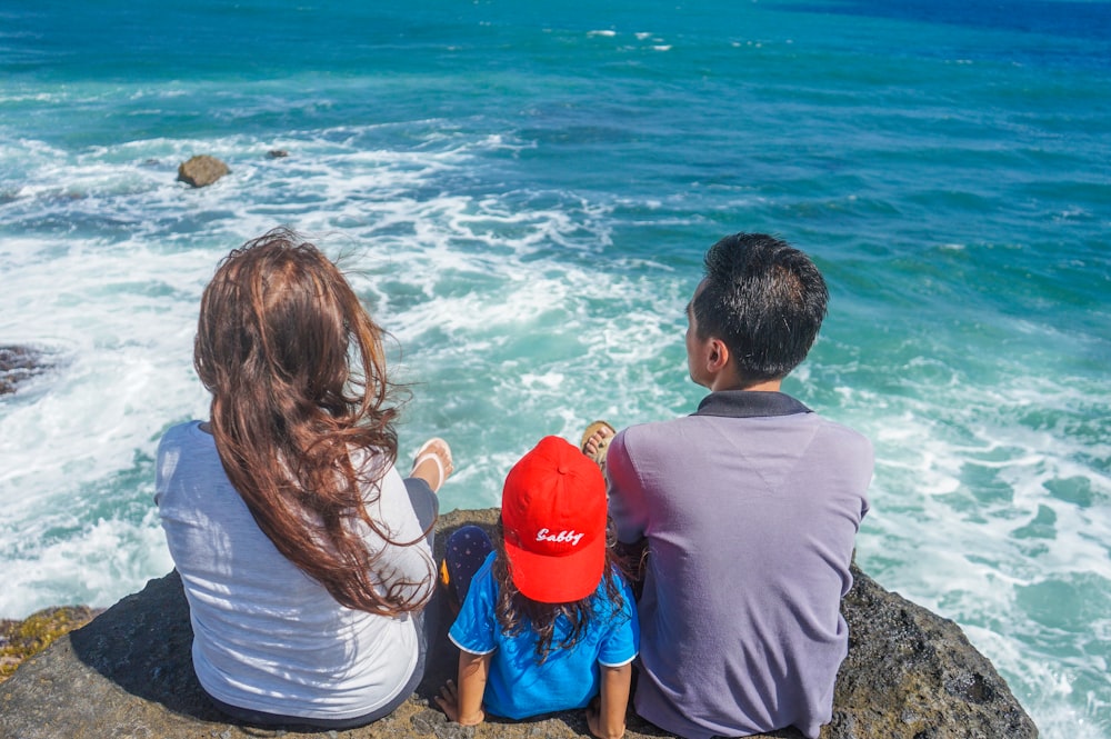Beautiful family looking into the ocean