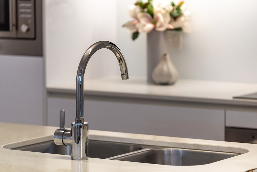 Goose neck style tapware in a modern kitchen.