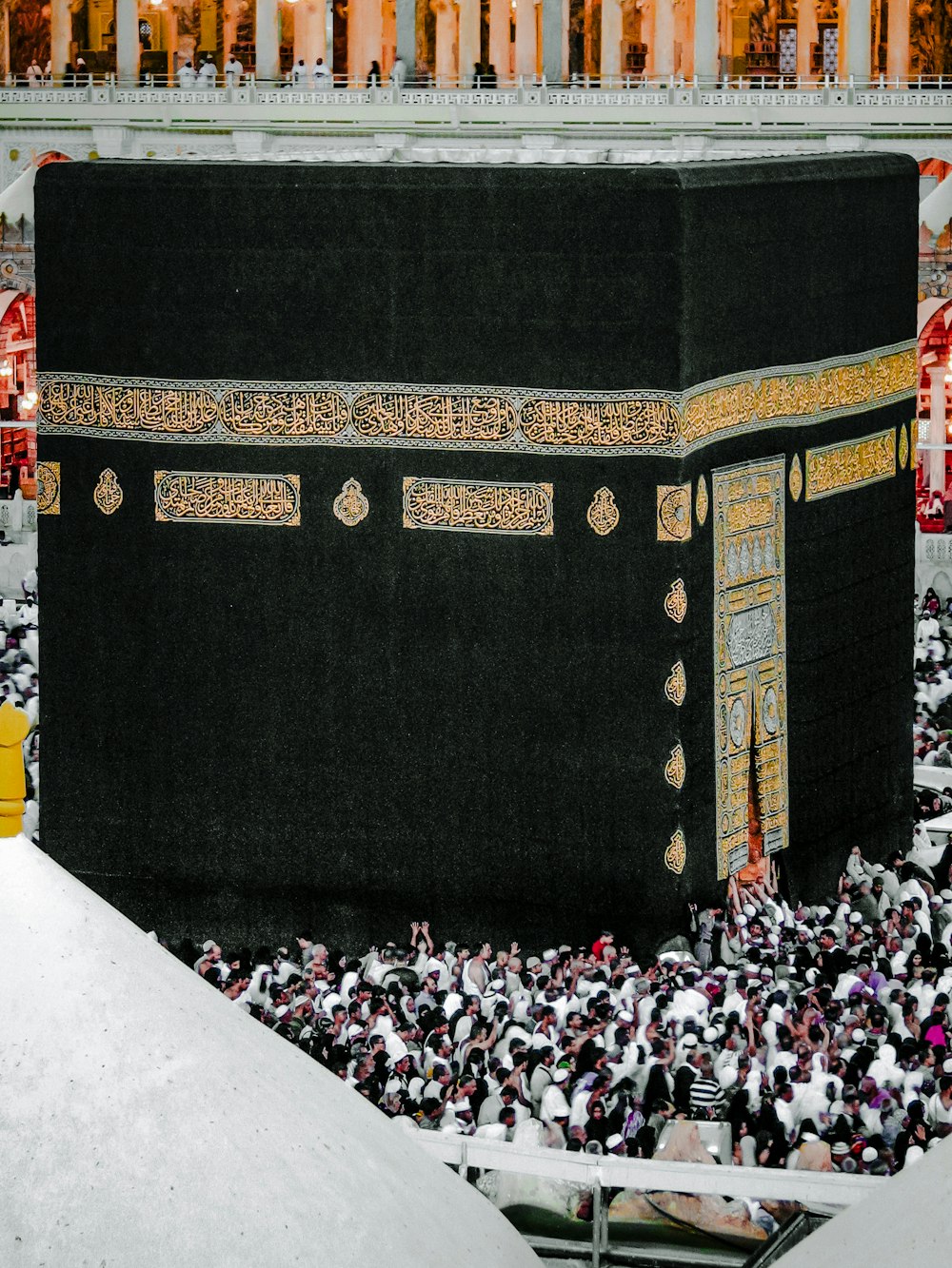 A Portrait Pic of Kaaba and people doing Tawaf e Haj and Umrah in Mecca, Saudi Arabia.